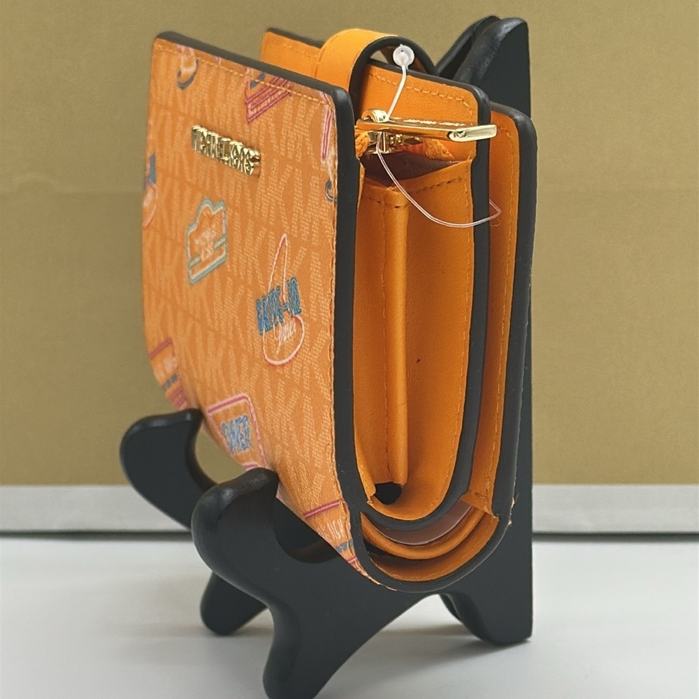 Michael Kors Jet Set Travel Medium Printed Signature Logo Bi-Fold 
Pop Orange - Picture 5 of 14